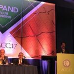 ACC 17 conference with a few guests on stage and a man giving a speech